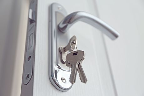 Technician re-keying a deadbolt cylinder