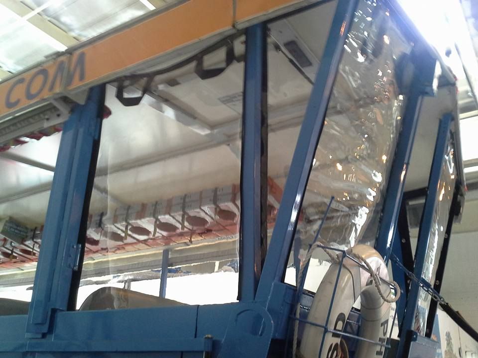 Blue cable car cabin with large windows at a station platform