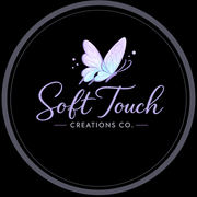 Soft Touch Creations Co. logo with pastel butterfly on a black circular background