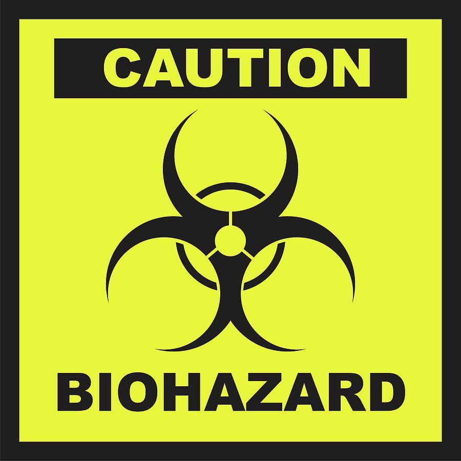A yellow sign that says caution biohazard on it