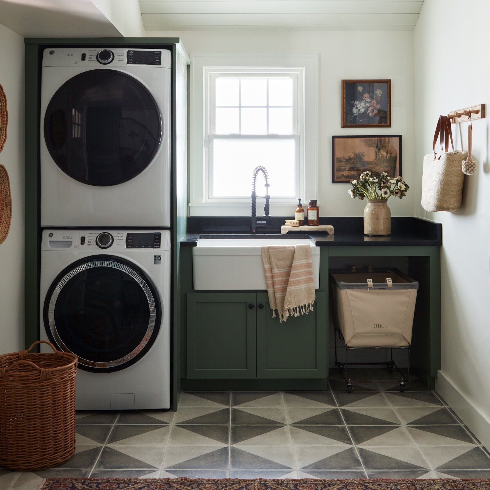 A laundry room with a washer and dryer stacked on top of each other
