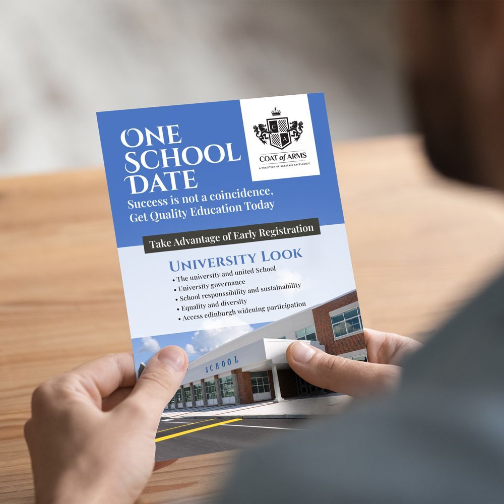A person is holding a postcard that says one school date A person is holding a postcard that says one school date