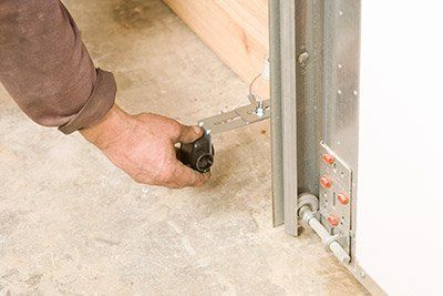 Setting Lock On Garage Door — St. Louis, MO — Edelen Door & Window Setting Lock On Garage Door — St. Louis, MO — Edelen Door & Window
