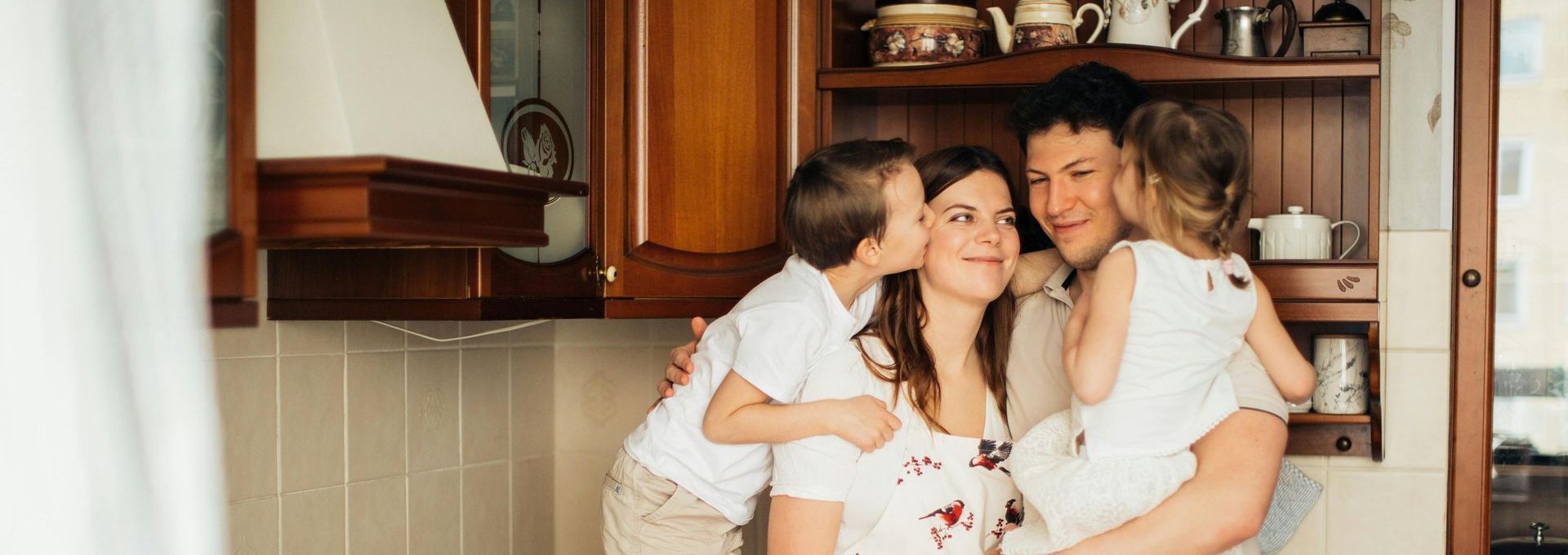 family in kitchen red deer rent-to-own house