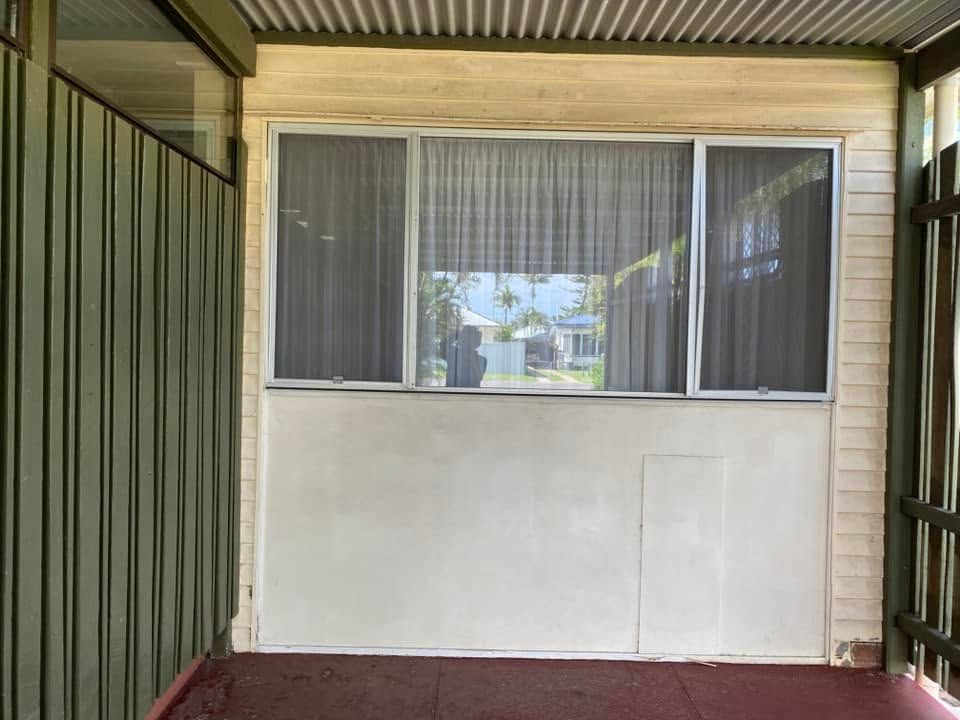Covered Patio Wall With Screened Window and White Exterior Siding — CPR Exterior Cleaning in Svensson Heights, QLD