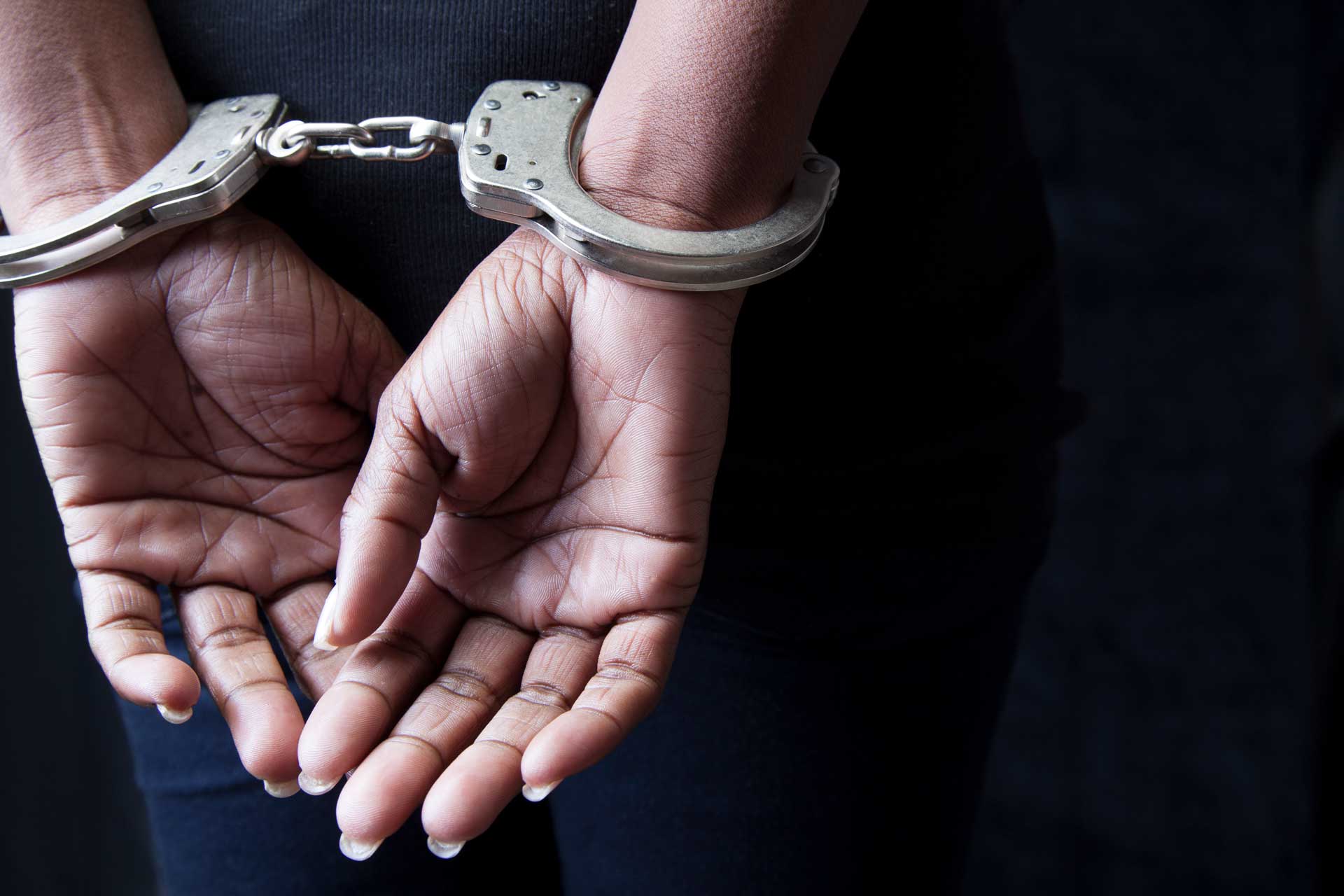 Hands with cuffs — Butler, PA — Matthew Fischer Law Office