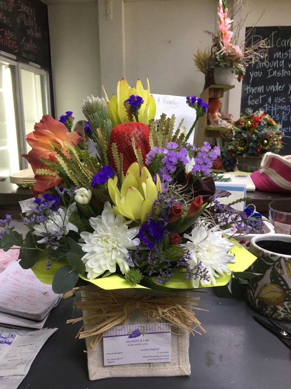 A Vase Filled with Flowers Is Sitting on A Table — Fiori With Love in Ingham, QLD
