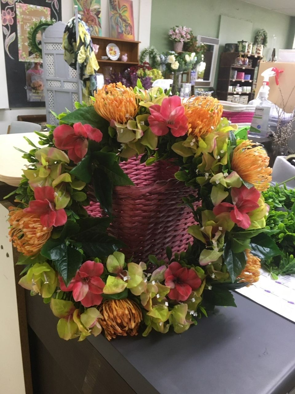 A Wreath of Flowers Is Sitting on A Table — Fiori With Love in Ingham, QLD