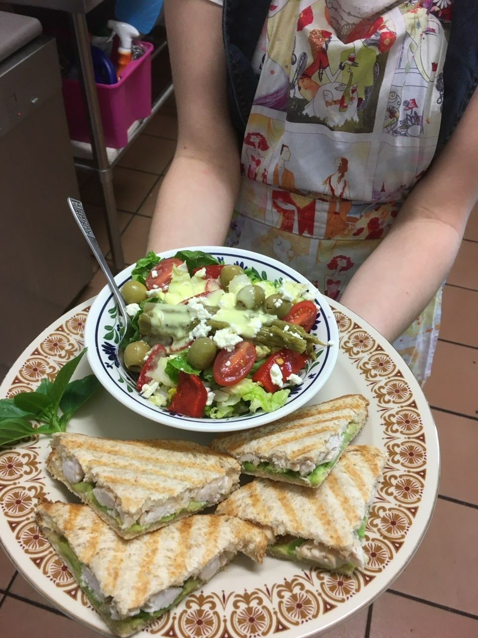 A Person Is Holding a Plate of Food and A Bowl of Salad — Fiori With Love in Ingham, QLD