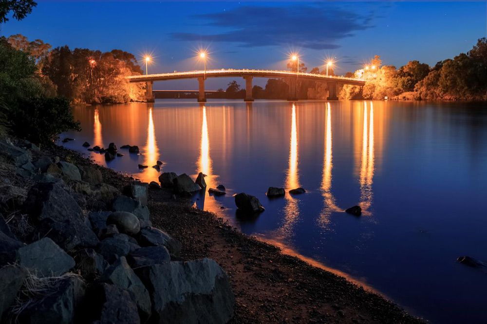 A Bridge Over a Body of Water at Night — TJL Business Advisors & Accountants in Taree, NSW