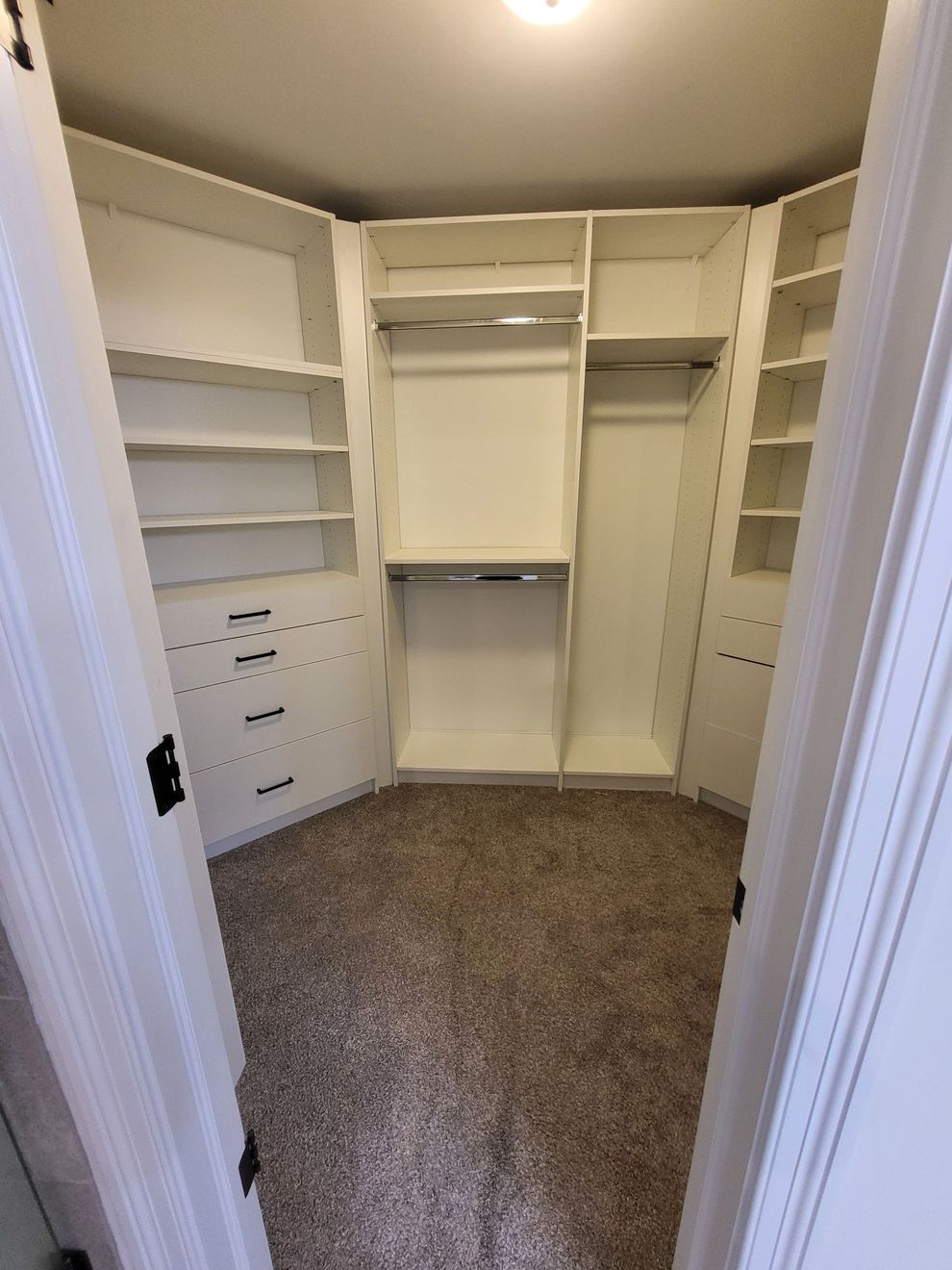 Corner walk-in closet in white
