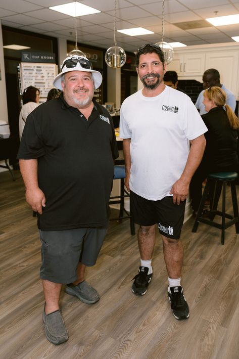 2 guys standing in front of a party