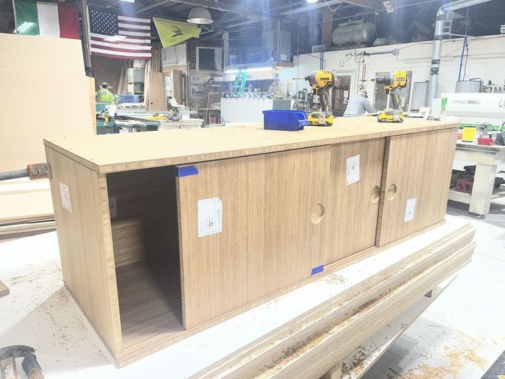 Bamboo console table with power tools on top 