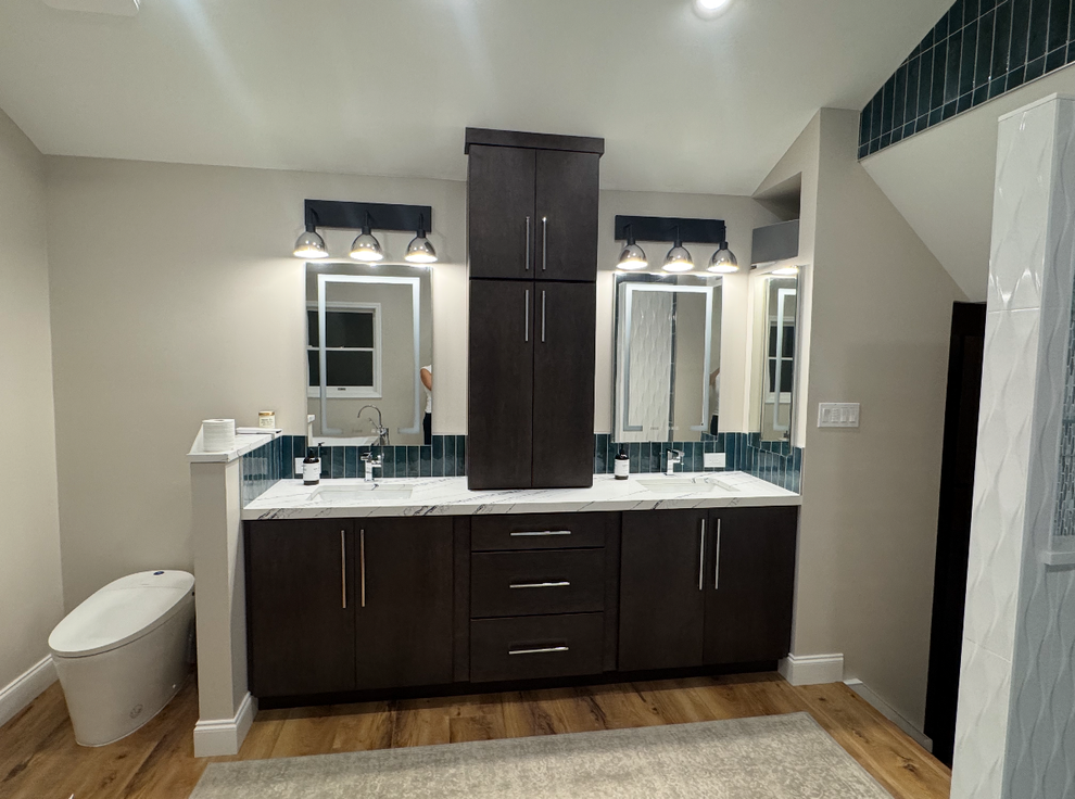 a double bathroom vanity with mirrors.