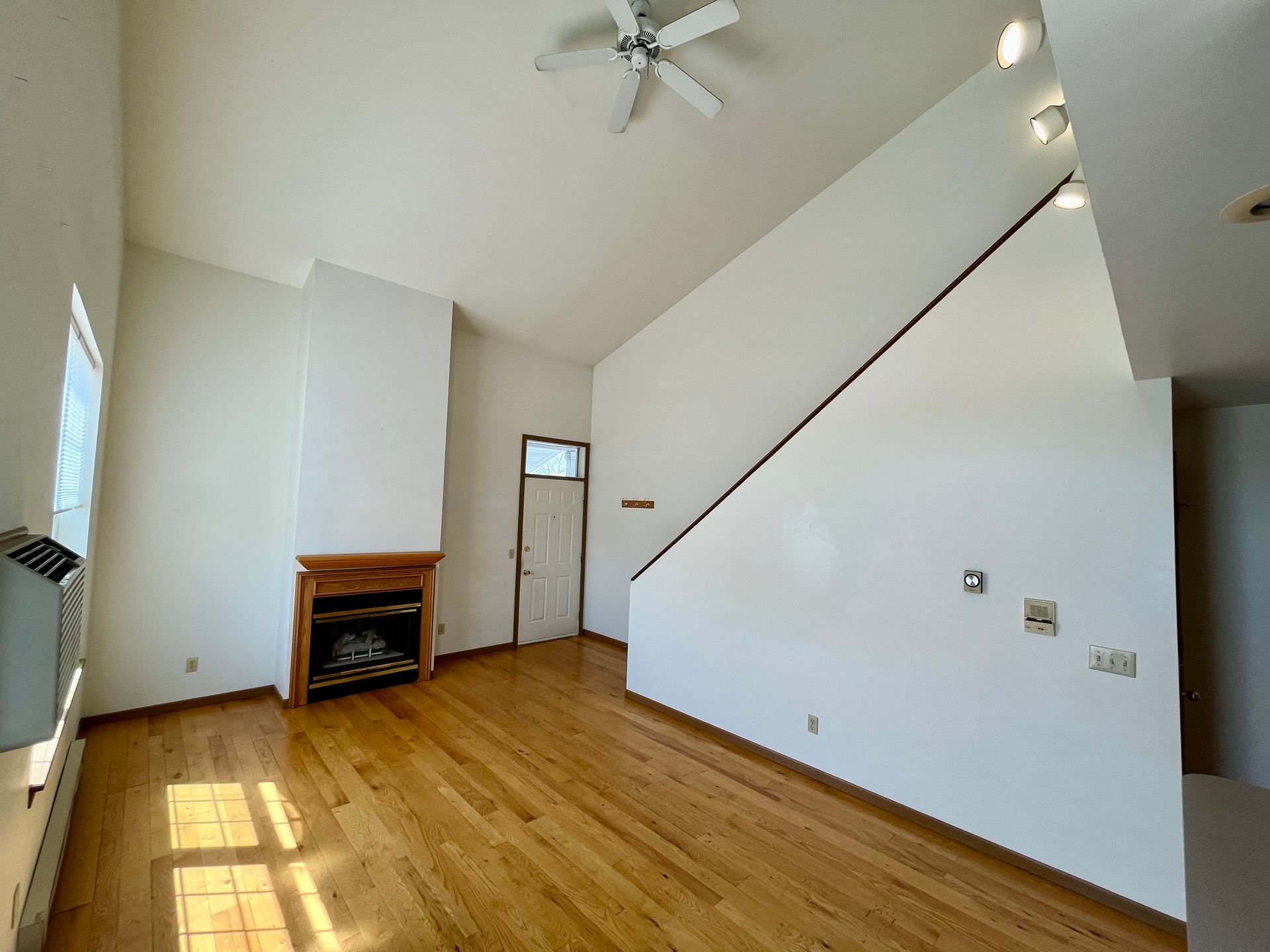 A view of the indoor pool at Rustic Woods townhomes with picnic tables in the back