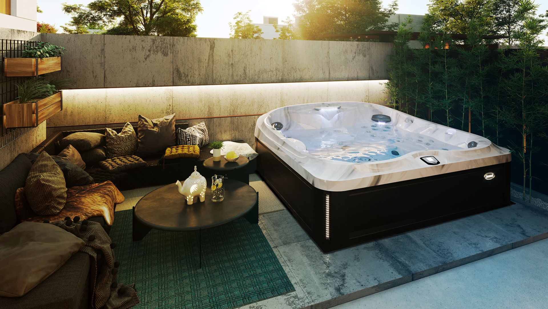 Outdoor patio with a cushioned sofa and a hot tub beside a small round table at sunset