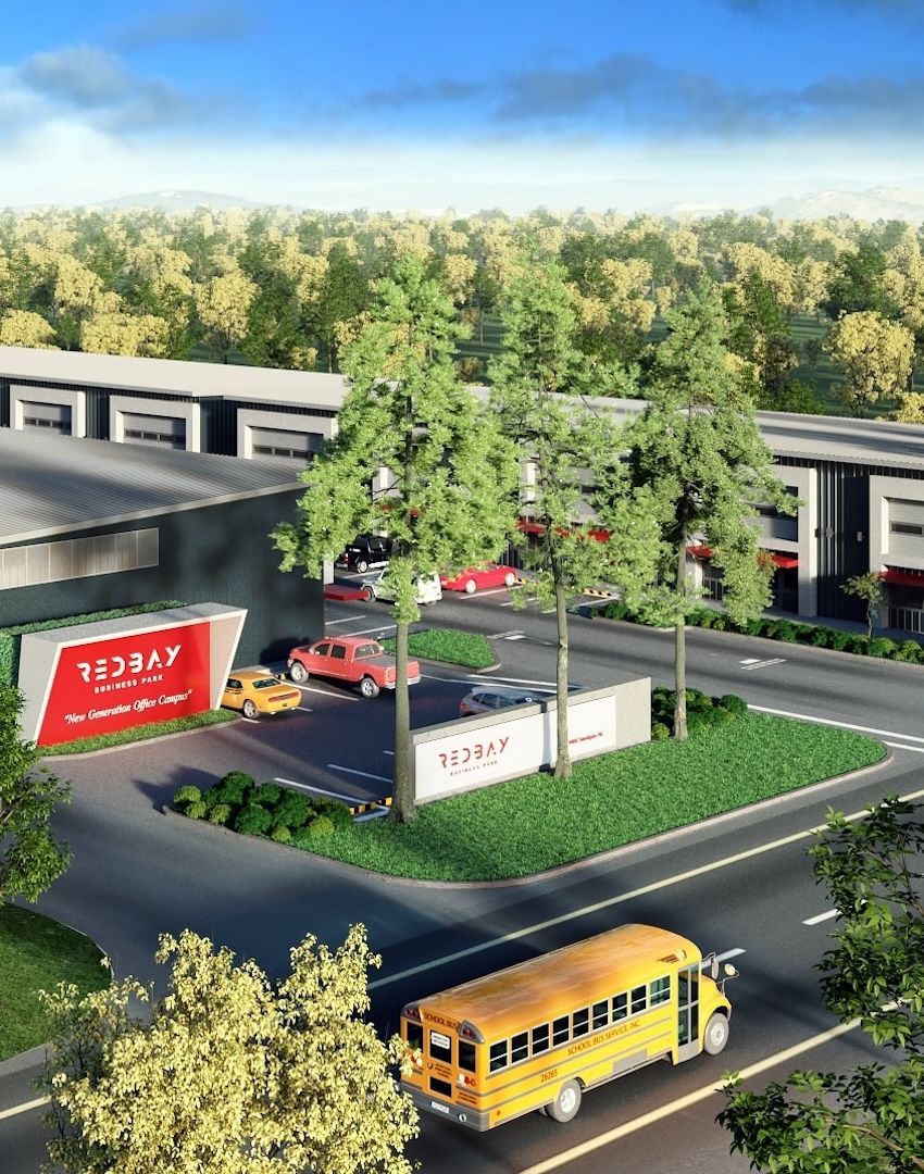 An aerial view of a school bus driving down a street