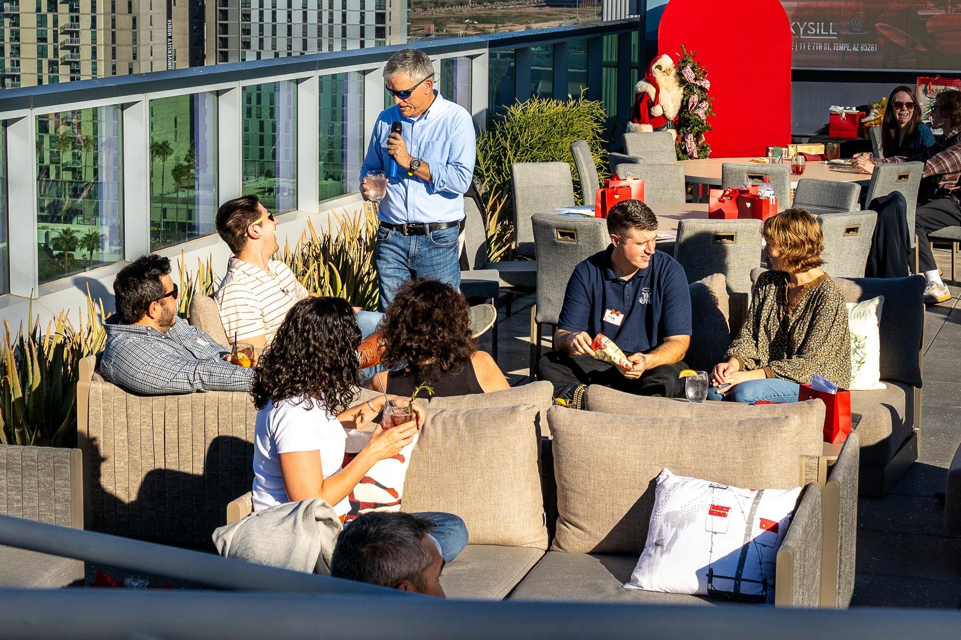 Business owners and founder Tracy Cobb gather at an outdoor venue.