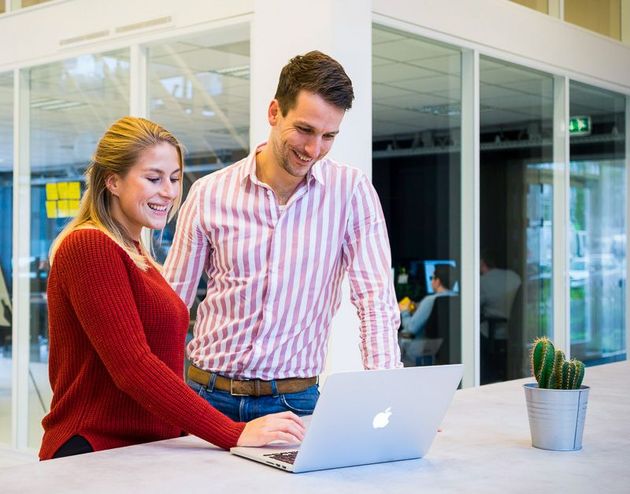 Business owners meet at office table to
discuss company decisions.