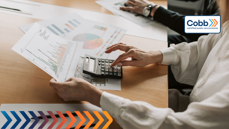 business owner reviewing and analyzing forward-looking financial reports