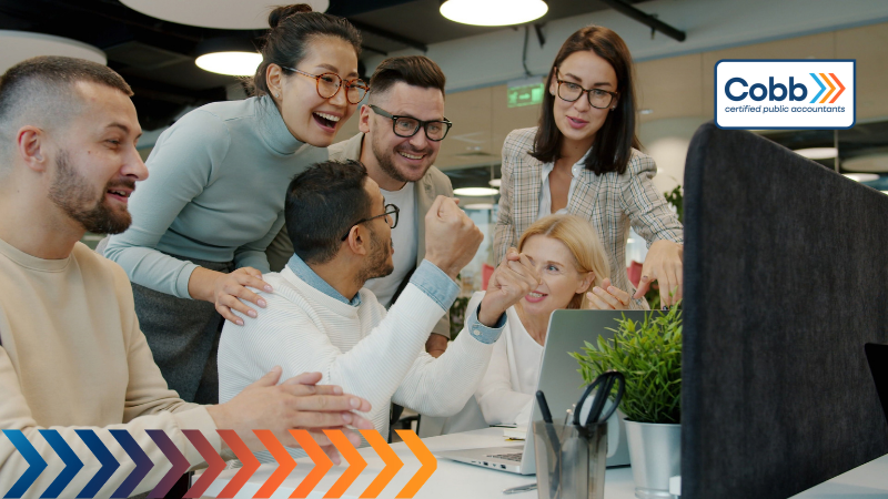 business owner cheers on employee wins to attract and keep great employees