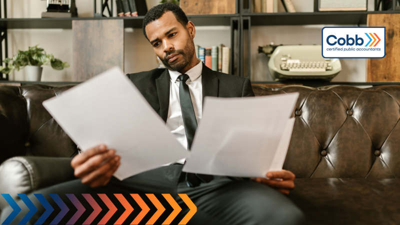 businessman reading his financial statements