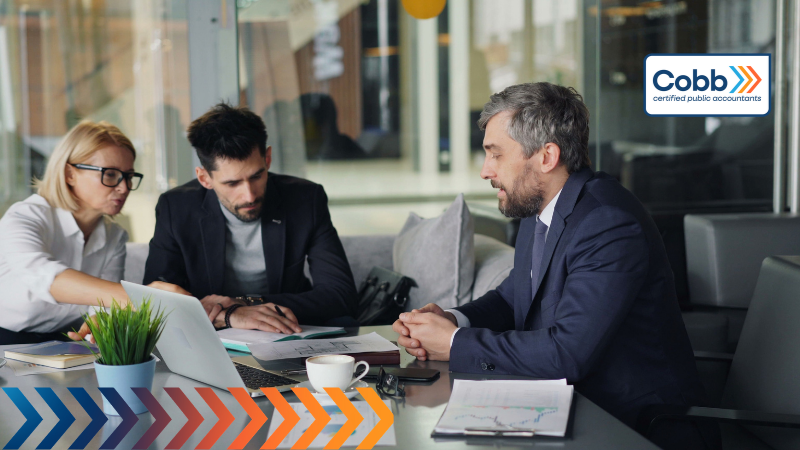 business owners talking to their cfo for year-end tax planning