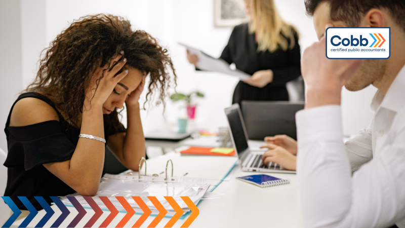 a business woman noticing year-end tax planning mistakes