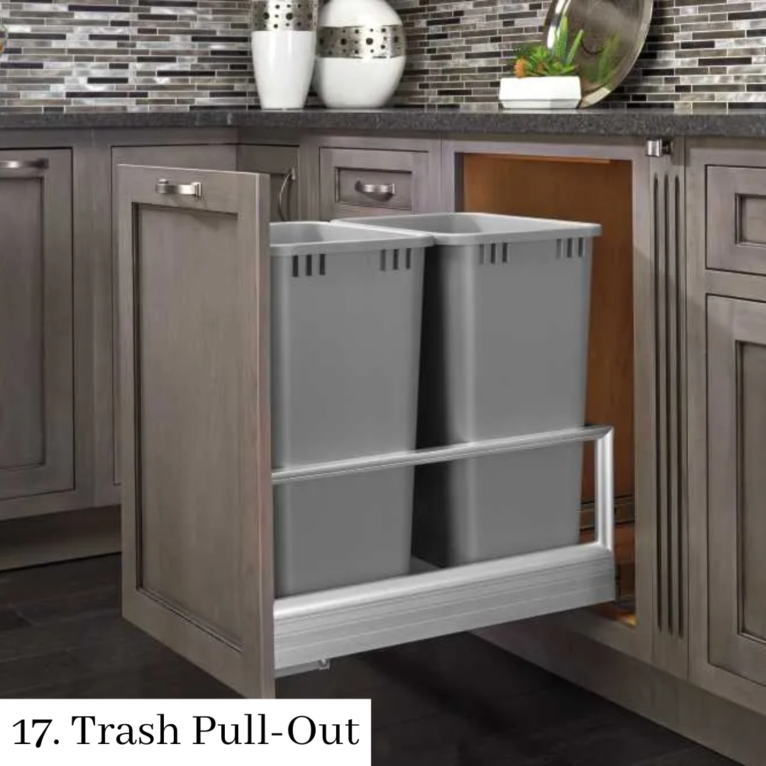 Kitchen cabinet with pull-out trash bins in a gray drawer organizer