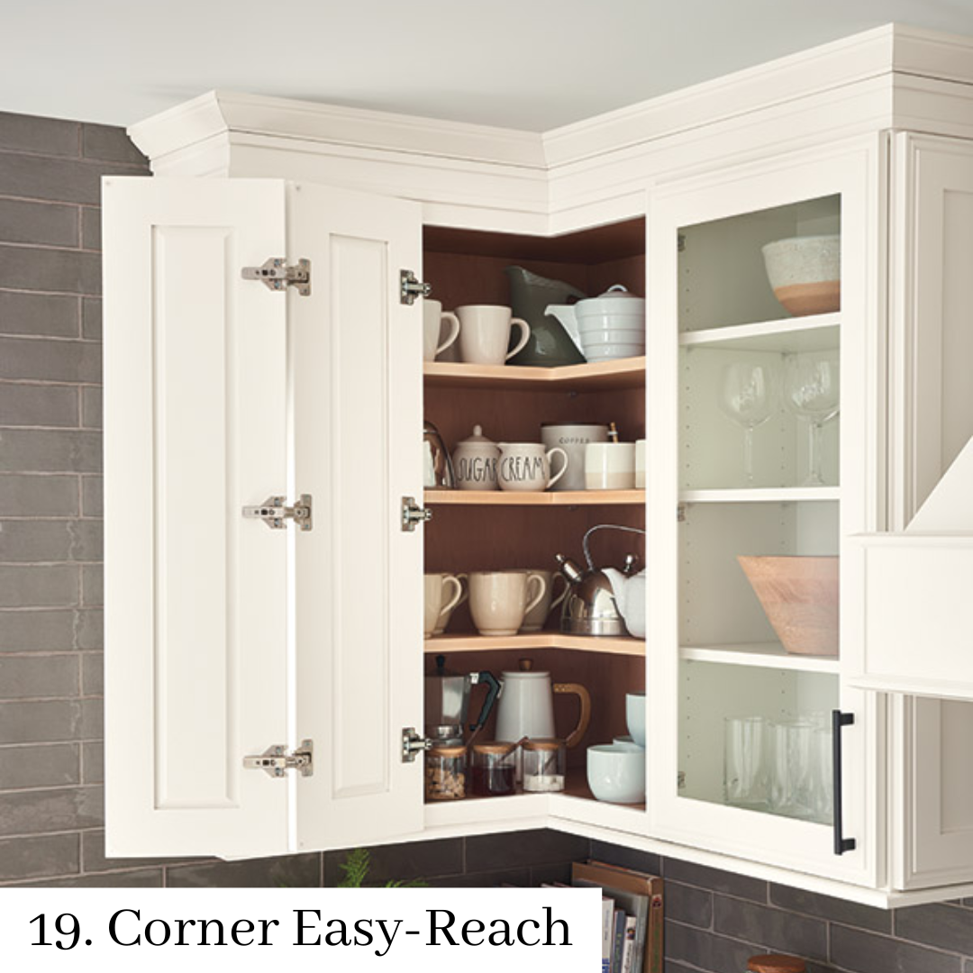 Corner kitchen cabinet with open shelves, mugs, and bowls, featuring a pull-out easy-reach design.