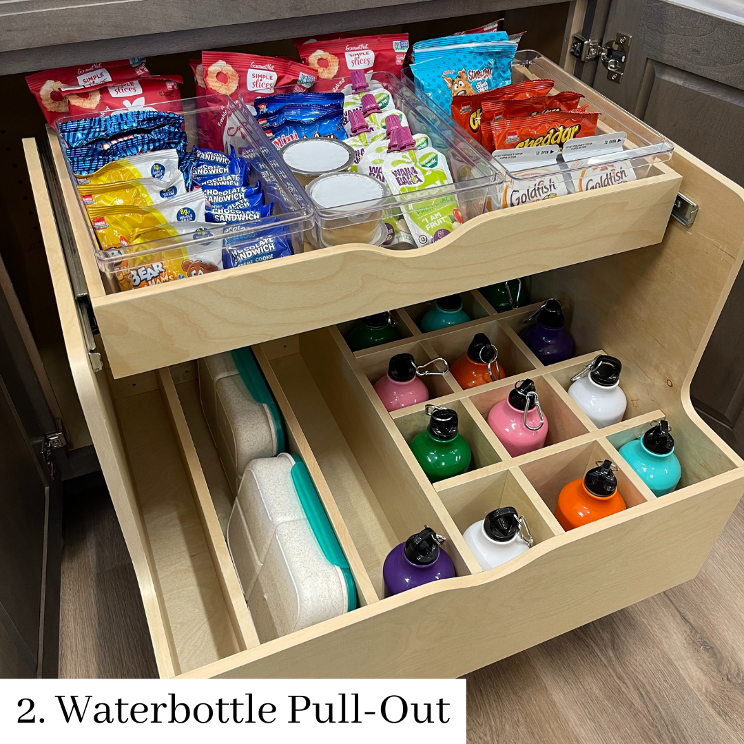 Pull-out drawer organizer with snacks, cups, and colorful water bottles in a cabinet