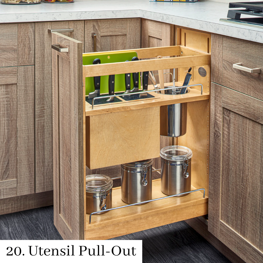 Pull-out kitchen utensil organizer with knives, jars, and cookware under a countertop
