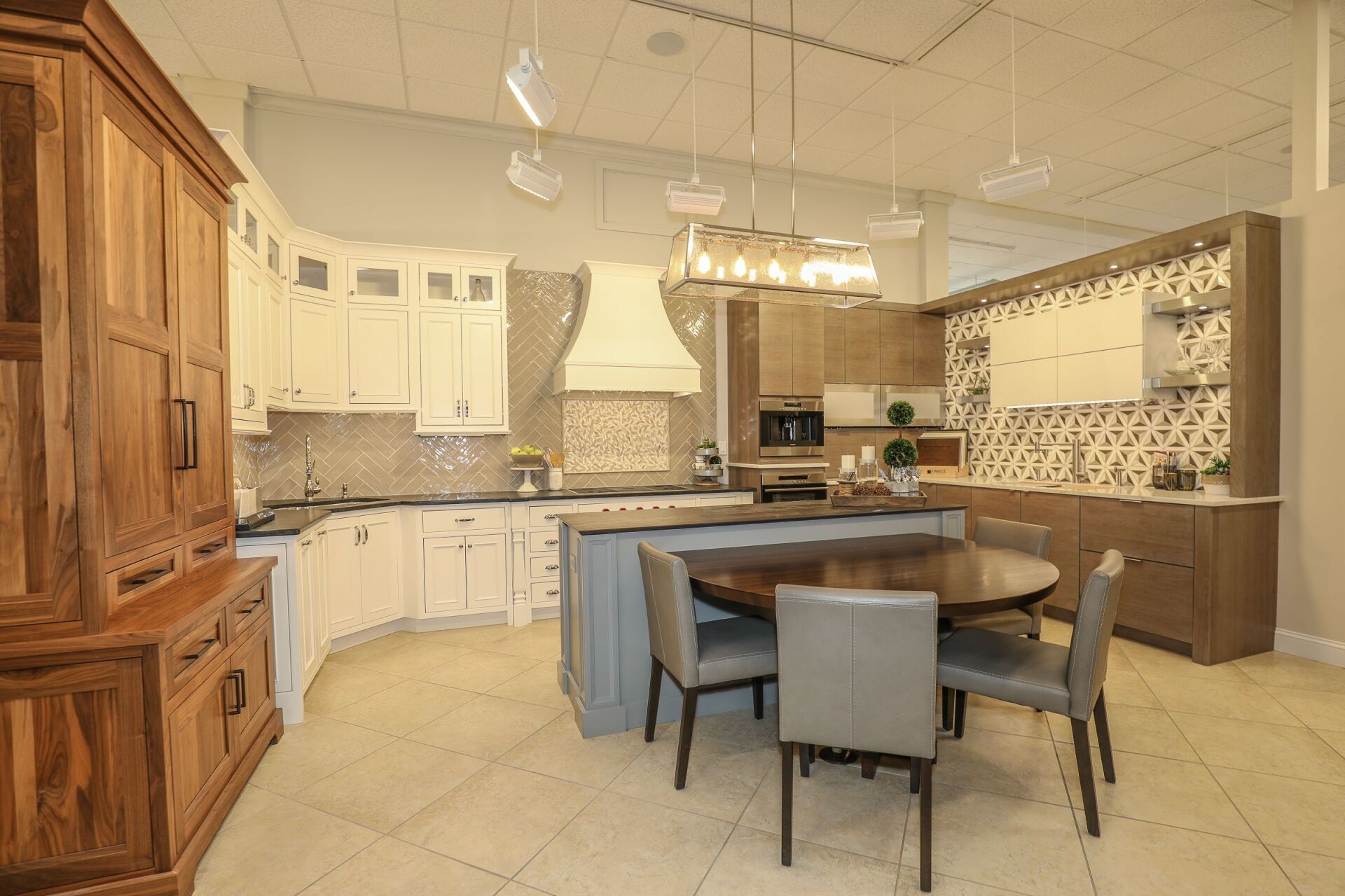 Modern kitchen with white cabinets, wood accents, and a round dining table with chairs