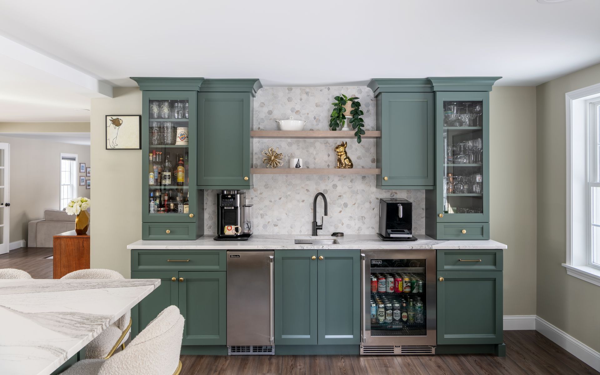 Modern teal kitchen with white countertops, open shelves, and a built-in coffee station