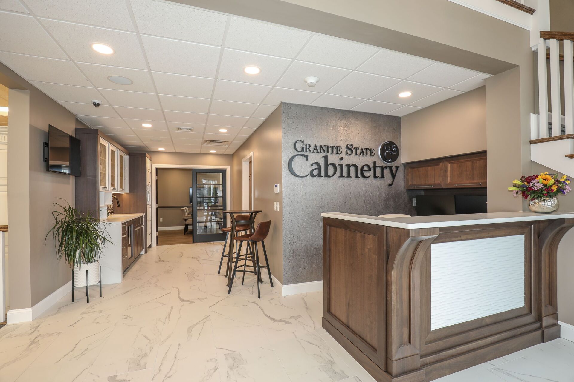 Modern cabinetry showroom with reception desk and display area