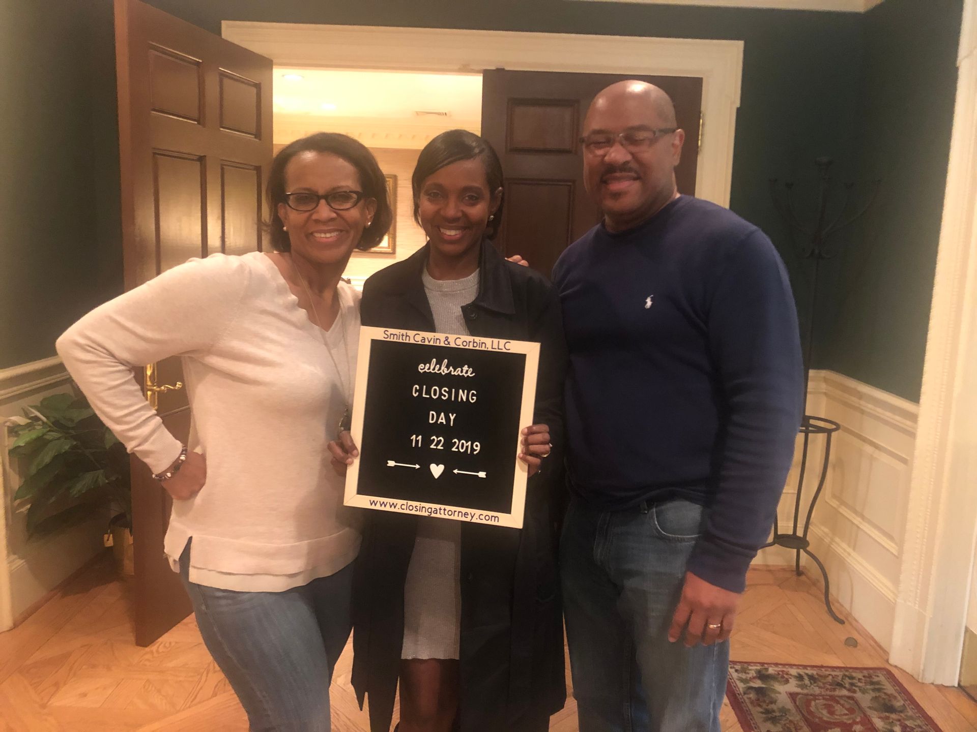 Rhonda Martin, Georgia Realtor with her clients after closing.