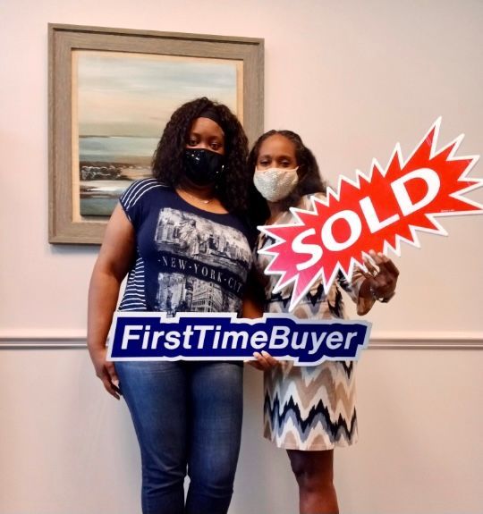 Rhonda Martin, Georgia Realtor with her client after a closing.