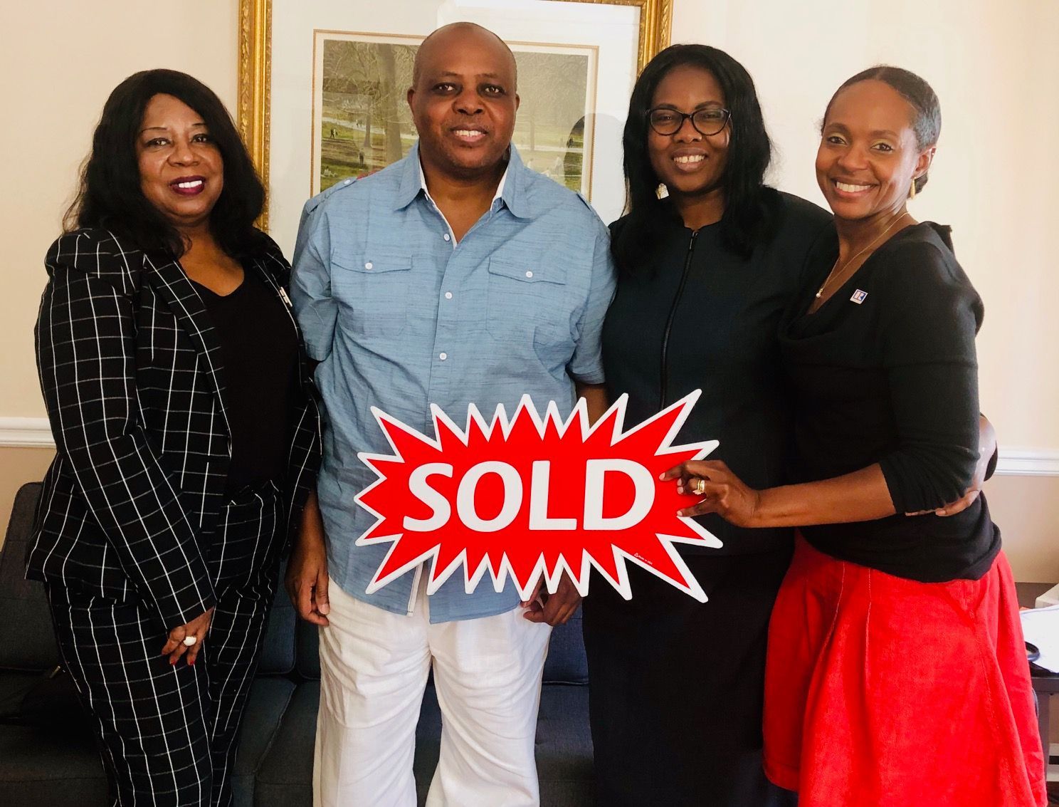Rhonda Martin, Georgia Realtor with her clients and their lender after closing.