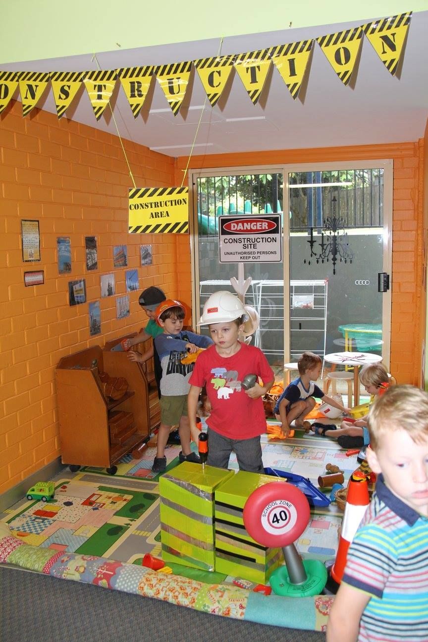 Children are playing in a room with a sign that says construction — Moruya Drive Child Care Centre In Port Macquarie, NSW