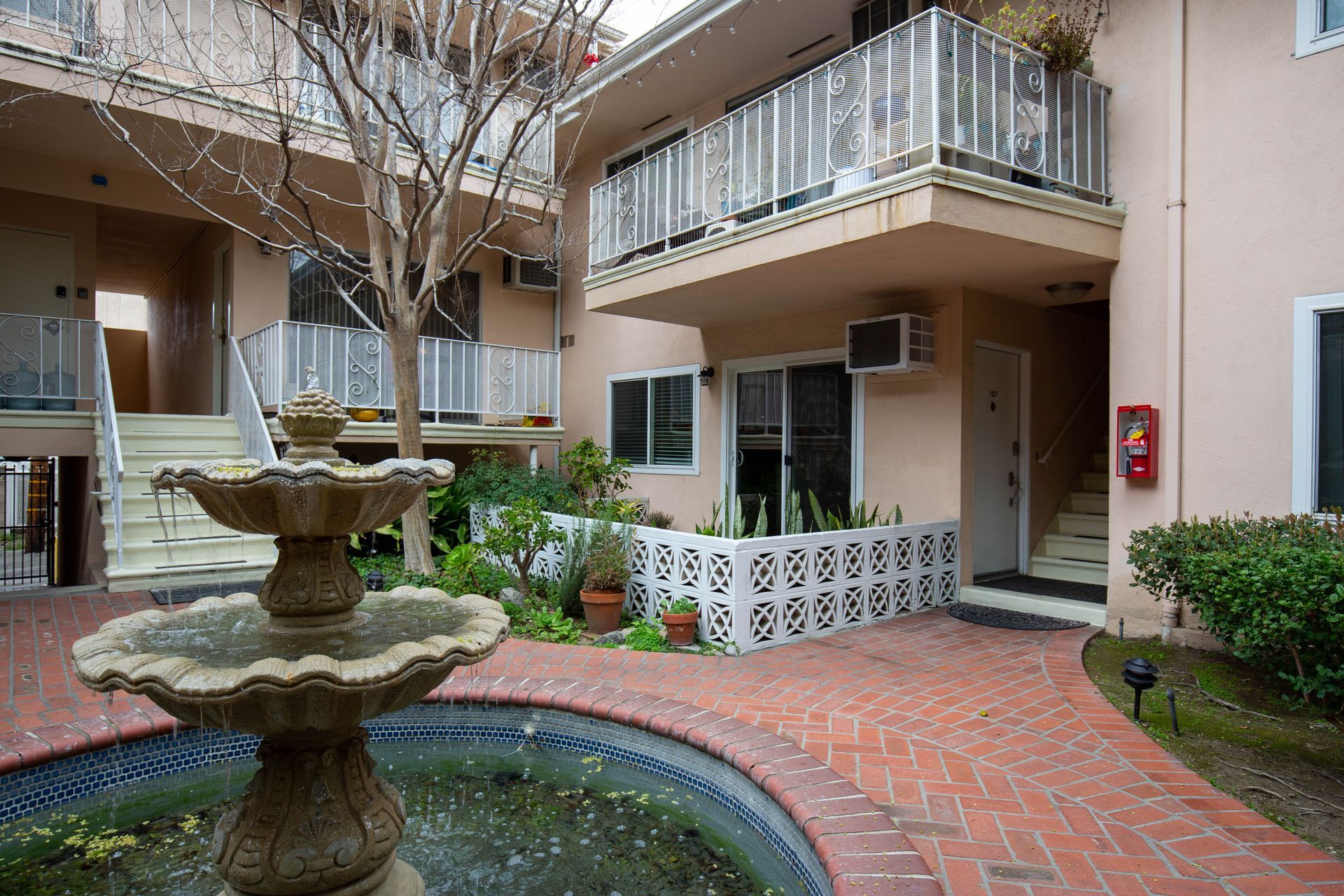 A fountain in the middle of a courtyard - Sky Properties Inc. - Your Trusted Property Management Experts in Toluca Lake