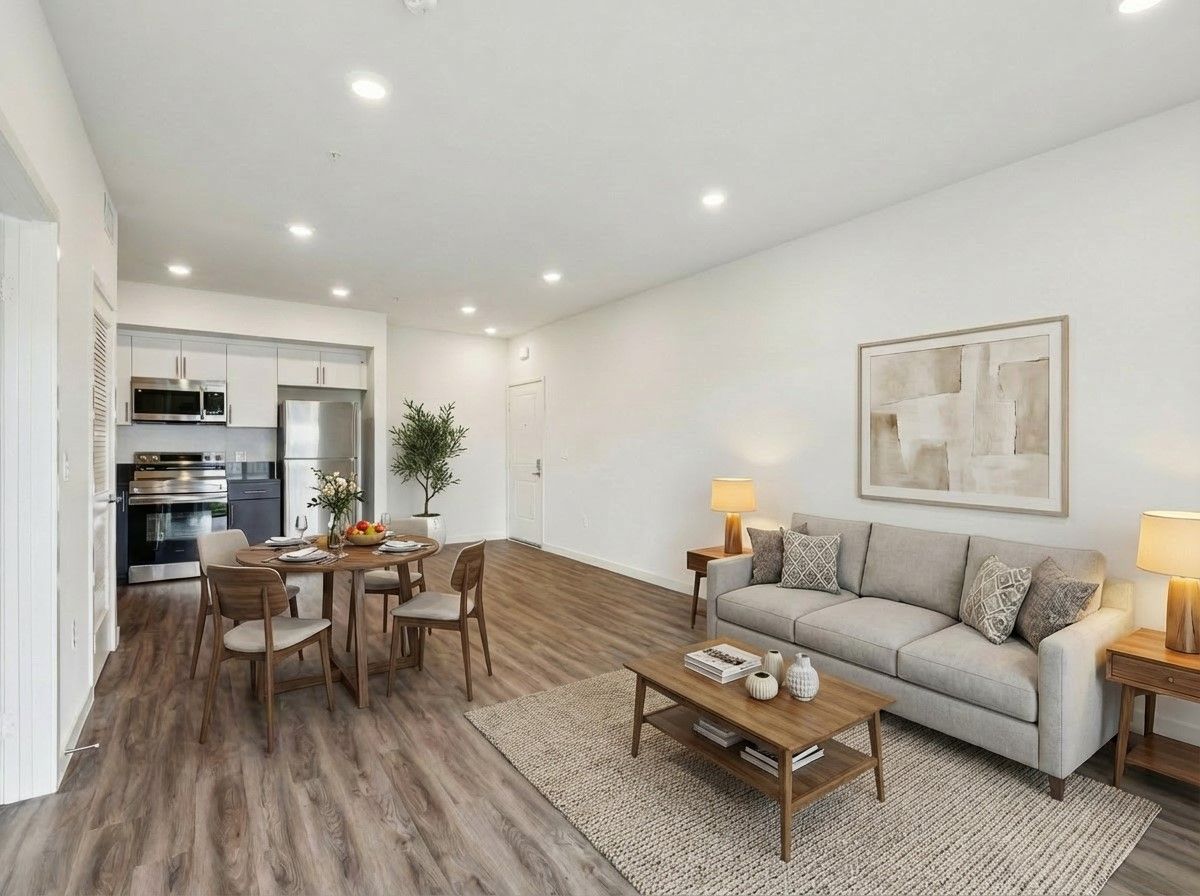 The fully equipped kitchen and spacious dining and living room at the Cloud Nine Luxury Apartments in Los Angeles