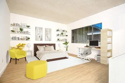 photo of a staged bedroom at Corbin, showing a bed on a carpet, wall shelves, desk, and chairs.
