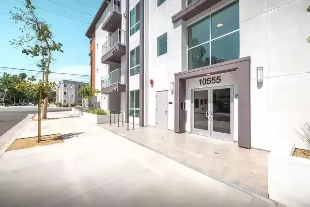 The Centennial Apartments spacious and bright interior with hardwood plank flooring all throughout