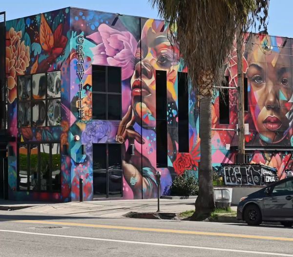 a photo of a fully hand painted mural wrap of a building in art district, los angeles