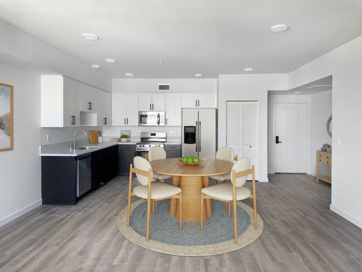 Cook up and enjoy a delicious meal in The Mix Apartments' modern kitchen and dining area