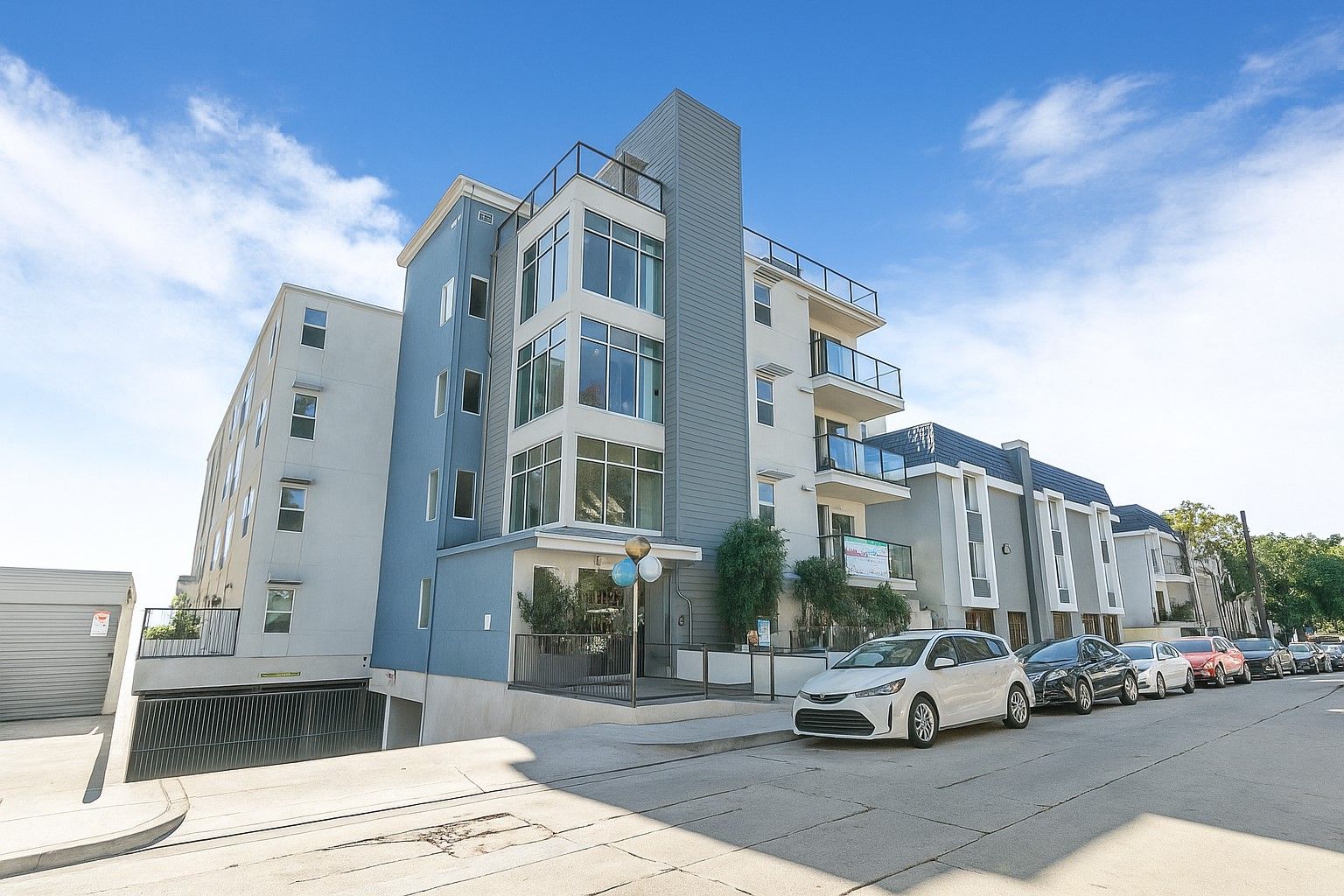 a daytime photo of the full building facade of the mix luxury apartments in toluca lake