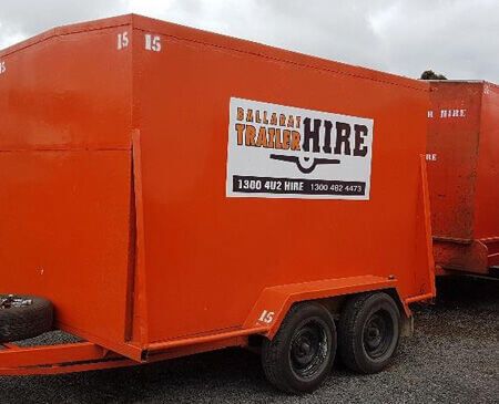 An Orange Furniture Van Trailer Sitting On Road — Ballarat Trailer Hire in Alfredton, VIC