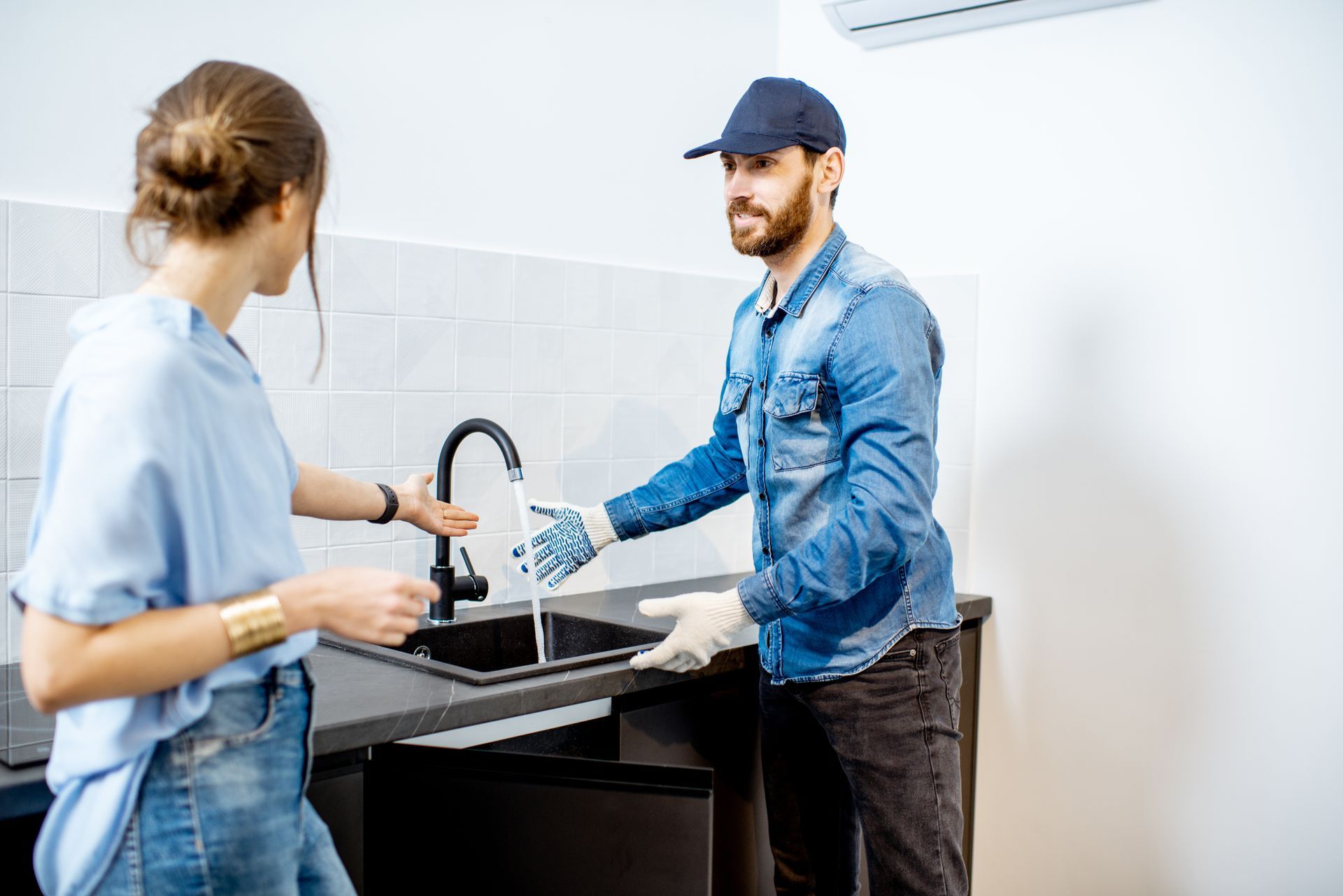 Handy man talking with young woman client.