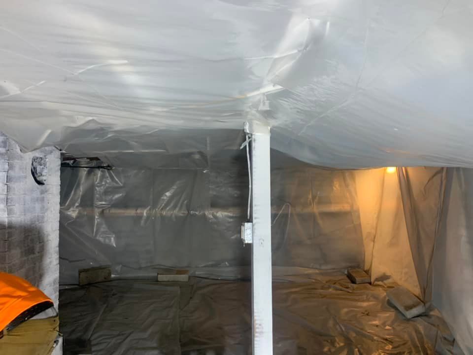 A room with a ceiling and walls covered in plastic.