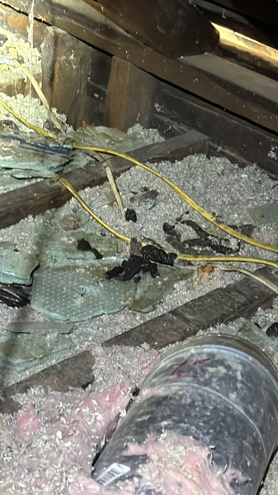 There is a pipe in the attic with a lot of insulation.